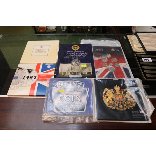 378 - Collection of Cased British Coinage to include United Kingdom 1986, 1992, 1983, 2008 & 2009