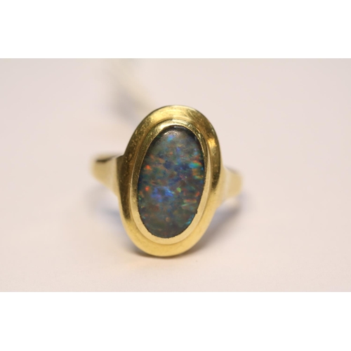 392 - Ladies 18ct Gold Oval Opal rub over set ring Size O. 4.7g total weight