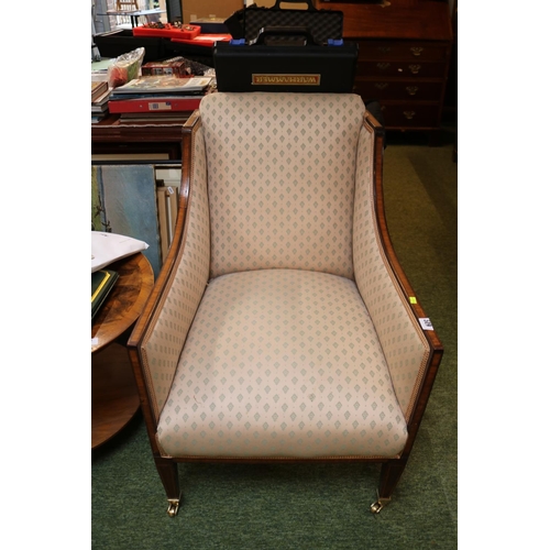 519 - Good Quality Walnut upholstered Elbow chair over tapering legs and brass casters