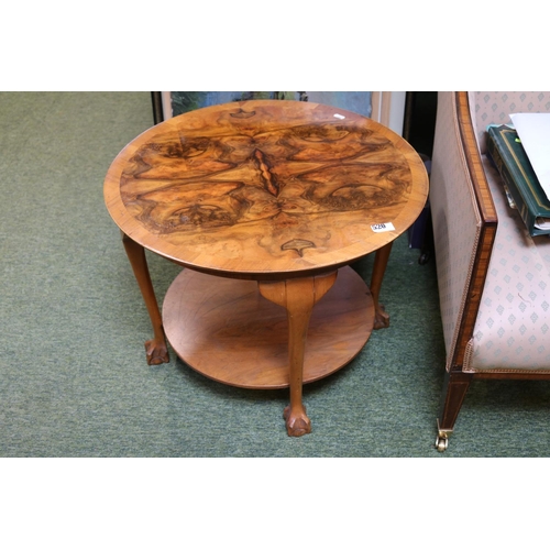 520 - Deco Walnut Quartered veneered circular coffee table with under tier on ball and claw feet