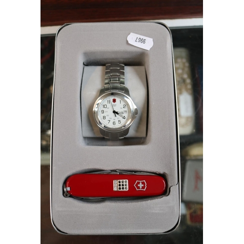 120 - Victorinox Swiss Army wristwatch and a Swiss Army Knife with Diamond Setting contained in Tin Case