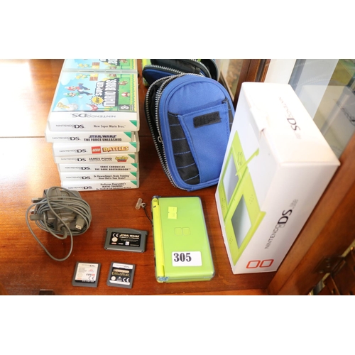 305 - Nintendo DS Lite with box and assorted games to include, Star Wars Force Unleashed, Super Mari Bros,... 