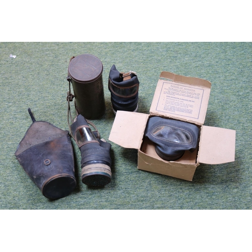 329 - Three Gas Masks to include one dated 1940 in tin (not Perished)