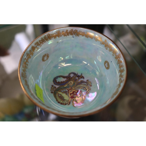 34 - Wedgwood dragon lustre bowl internally painted with three fruit and externally with twin dragons, pr... 