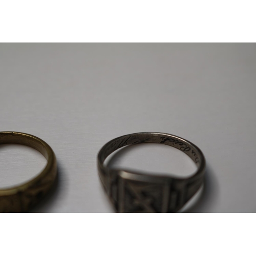 389 - A 1943 dated ring possibly military, a Skull ring and a yellow metal trench art example