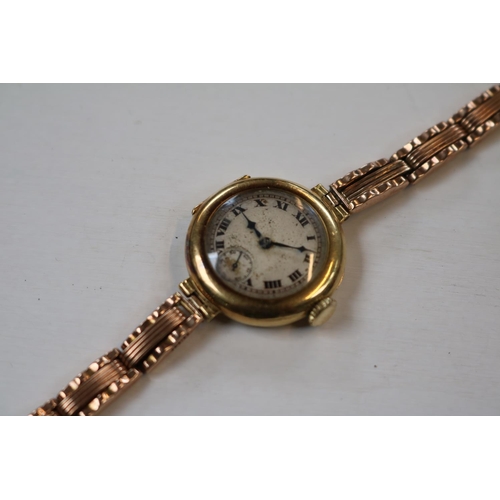 404 - Ladies 18ct Gold Wristwatch on a rose gold plated expanding bracelet