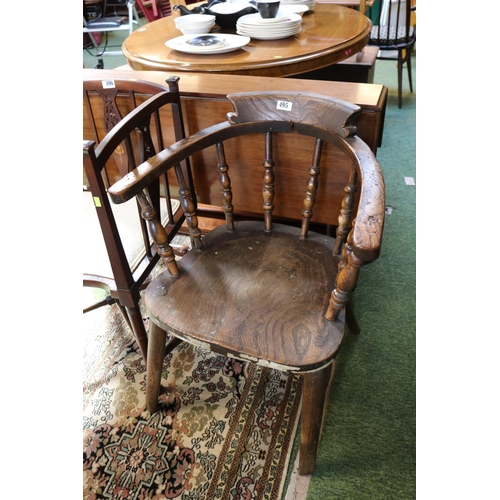 496 - Elm Smokers Bow Elbow chair with turned supports and tapering legs