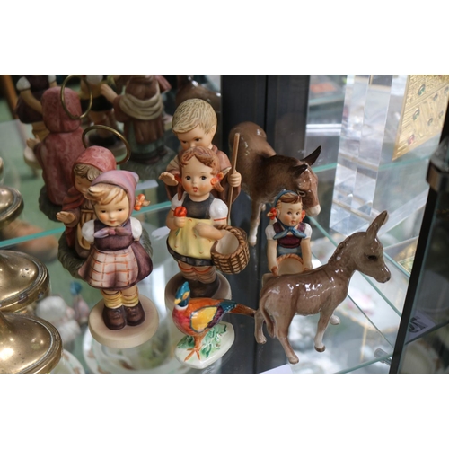 79 - Collection of Hummel figures, Beswick Donkeys and a Hand painted figure of a Pheasant