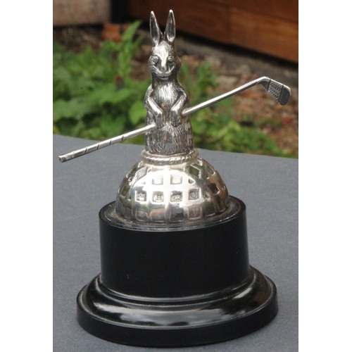 29 - Silver Rabbit Golf Trophy Square Mesh Golf Ball. A silver golf trophy featuring a rabbit or hare hol... 