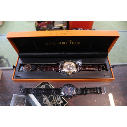 489 - Boxed Stuhrling Gents wristwatch with skeleton movement and another watch