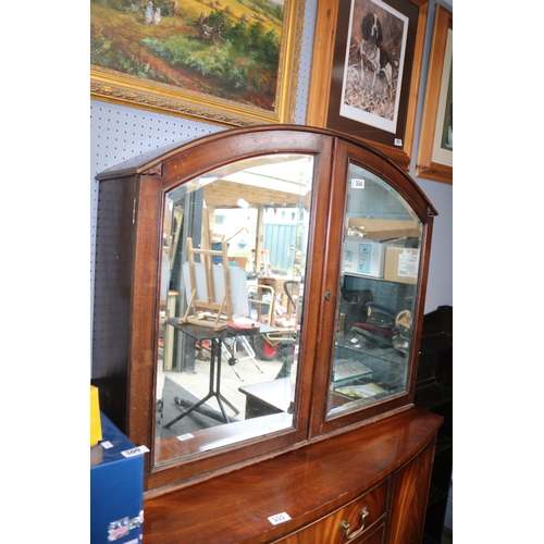 554 - Domed Mahogany cabinet with bevelled mirrored doors