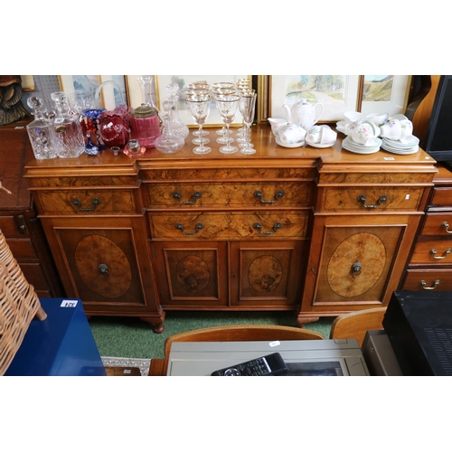 557 - Good quality Walnut fronted breakfront sideboard with brass drop handles over squat cabriole legs