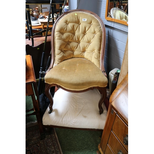 560 - Victorian Upholstered button back chair with carved French slender legs on brass casters