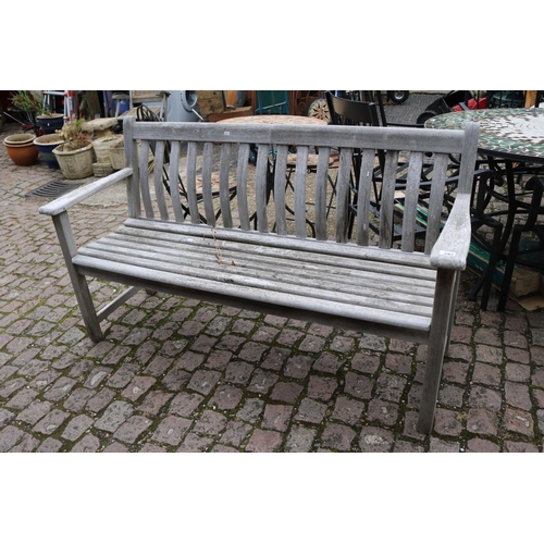 592 - Curved back wooden slatted bench