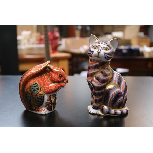 144 - 2 Royal Crown Derby Paperweights to include Cat no stopper and Squirrel LXI with Silver stopper