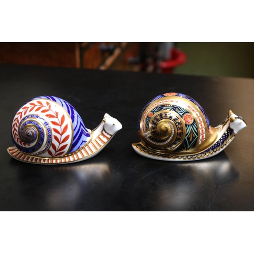 148 - 2 Royal Crown Derby Paperweights to include Golden Snail Limited edition 2371 of 4500 and another Sn... 