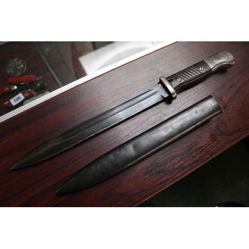 161 - German K98 Bayonet in scabbard stamped 42 cof 5648 bb 40cm in Length