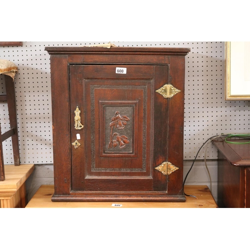 600 - Oak wall cabinet with carved panel door and brass fittings