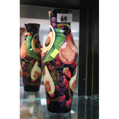 69 - Moorcroft Queens Choice pattern vase marked 200. 25cm in Height