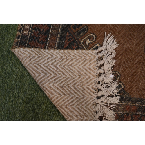 33 - Persian Design wool rug with knotted tassel ends 196 x 120cm