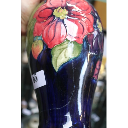 65 - Moorcroft Anemone blue ground vase with impressed and signed base. 25cm in height A/F