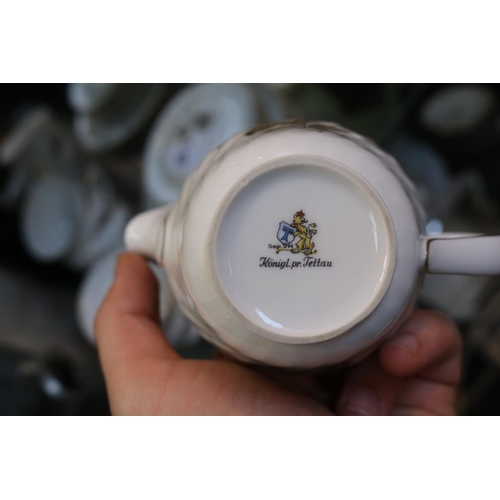 83 - European part tea set with floral decoration and gilt detail