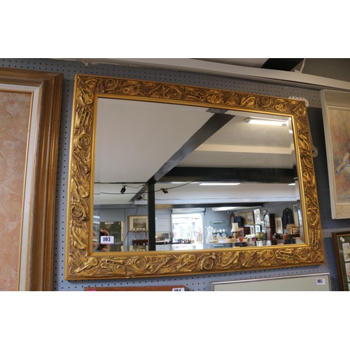 103 - Decorative Gilt Framed Music Instrument decorated bevel edge mirror