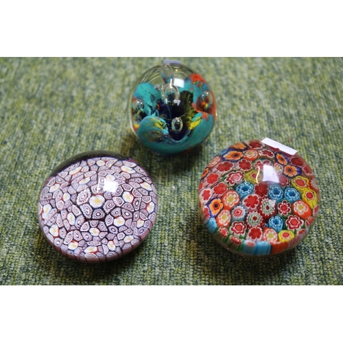 88 - 2 unmarked Millefiori paperweights and a later paperweight