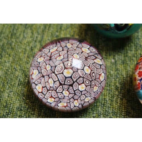 88 - 2 unmarked Millefiori paperweights and a later paperweight