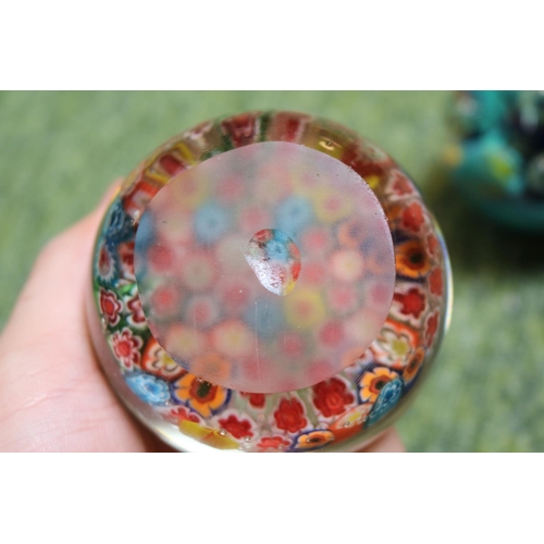 88 - 2 unmarked Millefiori paperweights and a later paperweight