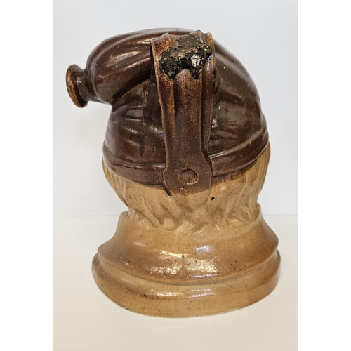 10 - Very large 19th C salt-glazed brown stoneware spirit flask of Souter Johnny. Wearing a smokers hat w... 