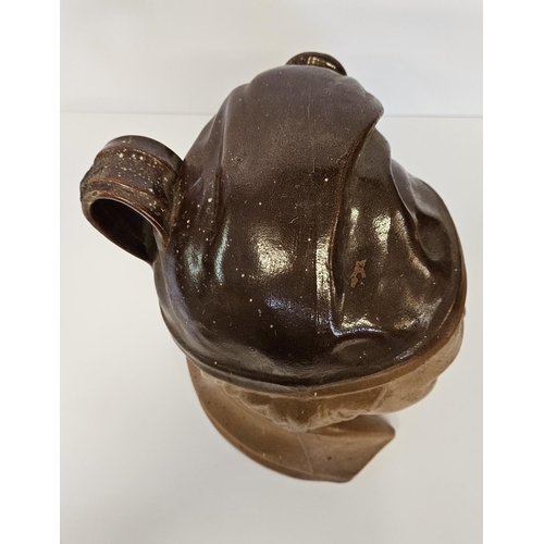 10 - Very large 19th C salt-glazed brown stoneware spirit flask of Souter Johnny. Wearing a smokers hat w... 