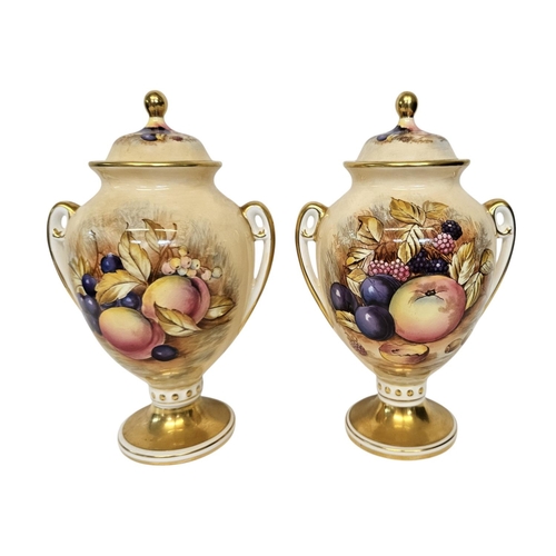 11 - Aynsley Orchard Gold pair of twin handled vases with covers.  Decorated with Fruit and Flowers with ... 