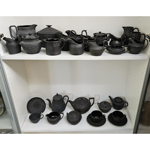 22 - Collection of Wedgwood Black Basalt tableware to include Teapots with covers, Sugar bowls, Cream Jug... 