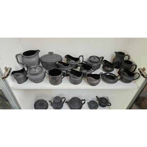 22 - Collection of Wedgwood Black Basalt tableware to include Teapots with covers, Sugar bowls, Cream Jug... 