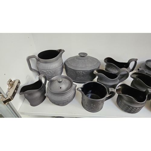 22 - Collection of Wedgwood Black Basalt tableware to include Teapots with covers, Sugar bowls, Cream Jug... 