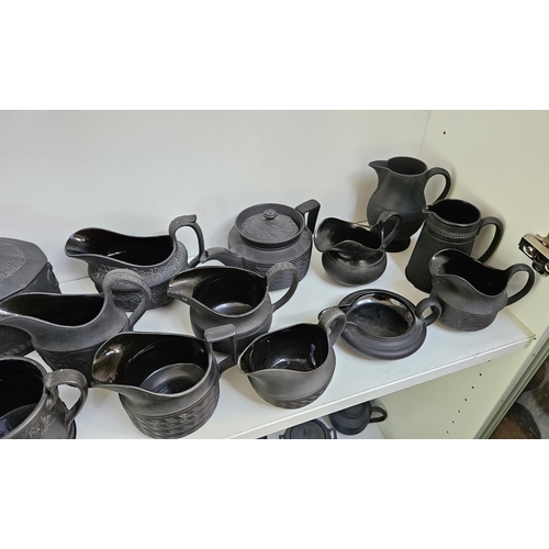 22 - Collection of Wedgwood Black Basalt tableware to include Teapots with covers, Sugar bowls, Cream Jug... 