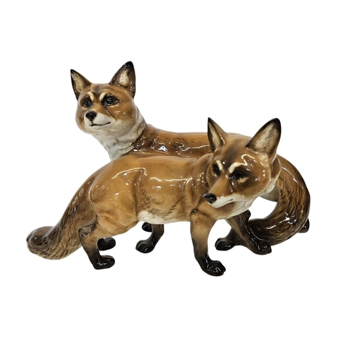 3 - Hutschenreuther Fox and Vixen group a porcelain group of two standing Foxes. Marked underneath, Germ... 