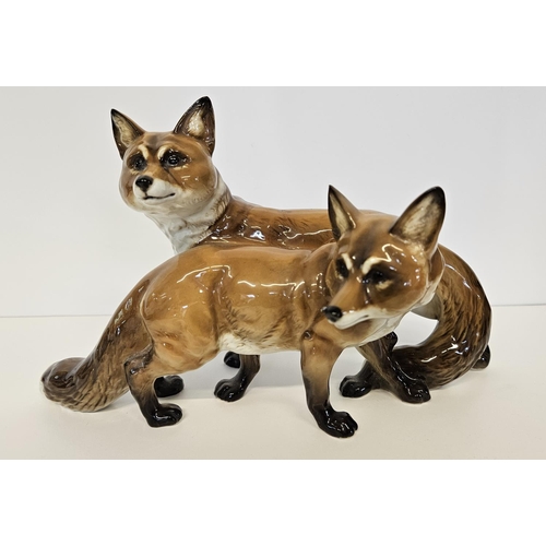 3 - Hutschenreuther Fox and Vixen group a porcelain group of two standing Foxes. Marked underneath, Germ... 