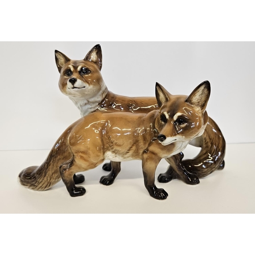 3 - Hutschenreuther Fox and Vixen group a porcelain group of two standing Foxes. Marked underneath, Germ... 