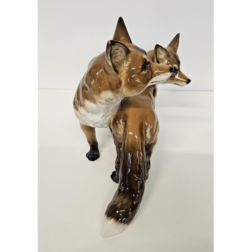 3 - Hutschenreuther Fox and Vixen group a porcelain group of two standing Foxes. Marked underneath, Germ... 