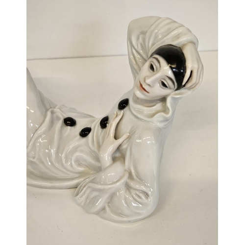 6 - A Rosenthal figure of a Pierrot, designed by Rudolf Greiner, modelled lying down printed and painted... 