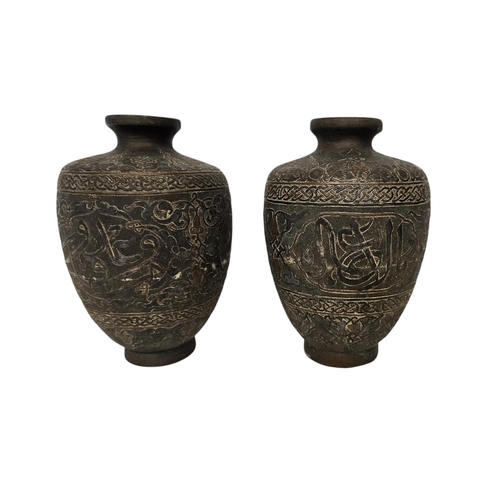 41 - Islamic Style Bronze Calligraphic Vase with Silver Overlay An undated archaistic hollow-cast Baluste... 