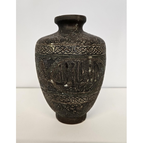 41 - Islamic Style Bronze Calligraphic Vase with Silver Overlay An undated archaistic hollow-cast Baluste... 