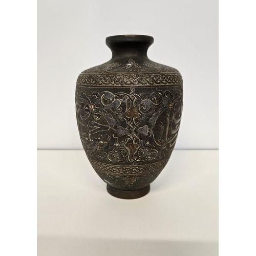 41 - Islamic Style Bronze Calligraphic Vase with Silver Overlay An undated archaistic hollow-cast Baluste... 