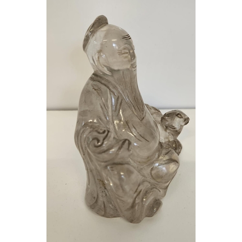 44 - 18thC Chinese carved rock crystal Buddha /Wiseman with seated dog. H 10.5cm W 11cm.