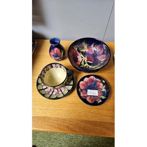 97B - Collection of assorted Moorcroft Ceramics to include Small vase, Pin dish, Cup and saucer and a Anem... 