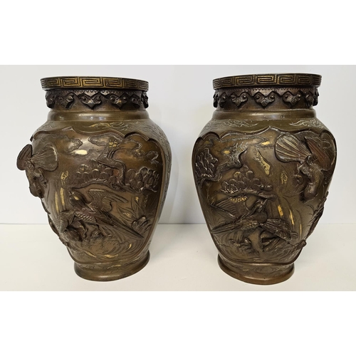 51 - Pair of Japanese Meiji period Bronze parcel glit high relief vases decorated with Storks and rocky o... 