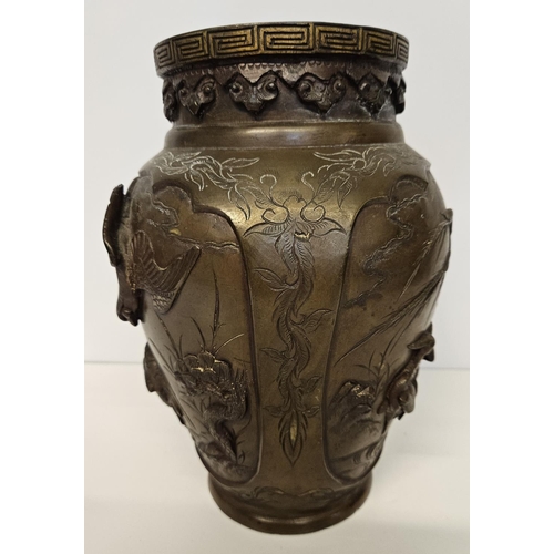 51 - Pair of Japanese Meiji period Bronze parcel glit high relief vases decorated with Storks and rocky o... 