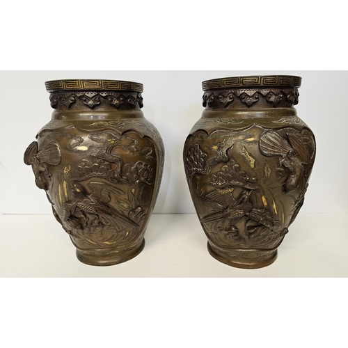 51 - Pair of Japanese Meiji period Bronze parcel glit high relief vases decorated with Storks and rocky o... 